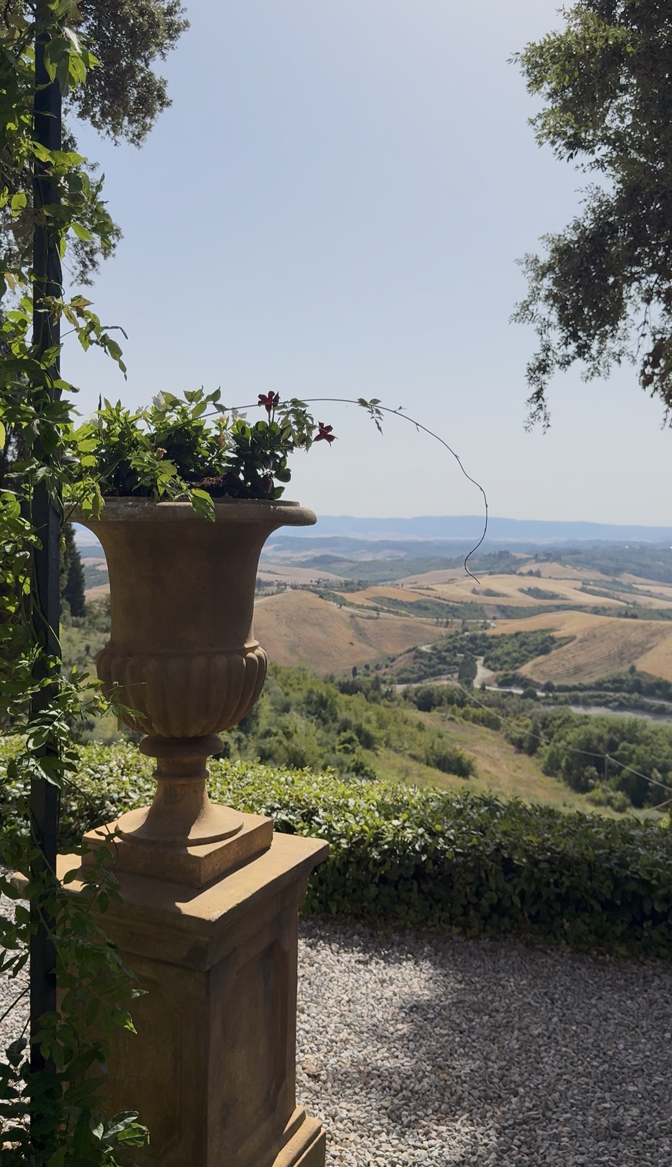 A stone urn overlooking the Tuscan countryside